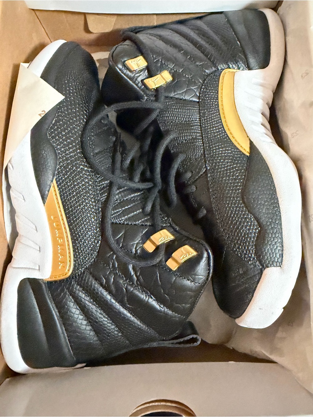 Nike Women’s Black and Gold Retro Jordan 12 - size 8